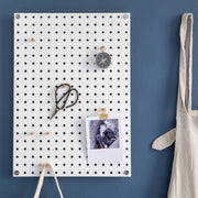 White Pegboard With Wooden Pegs